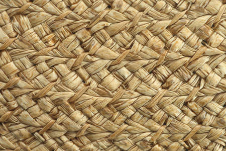 Light tan woven straw texture close abstract