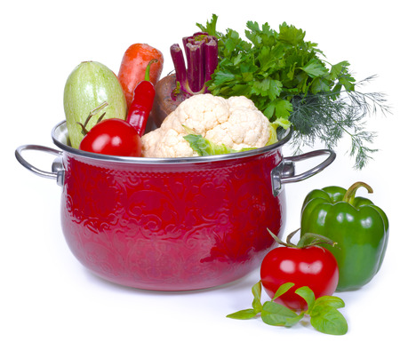 fresh vegetables in red potの写真素材