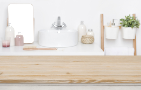 Wooden tabletop for product display over defocused bathroom interiorの写真素材