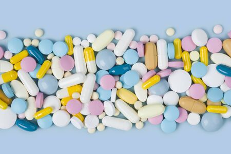 Lots of various colorful medicine drugs, pills, tablets and capsulesの写真素材