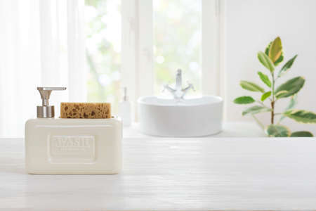 Rough texture table for product display before blurred kitchen windowの写真素材