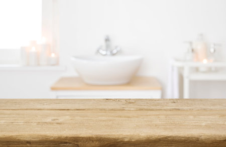 White folded spa towel and orchid flowers on wooden tableの写真素材
