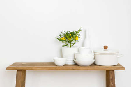 Set of clean dishes on wooden table and white backgroundの写真素材