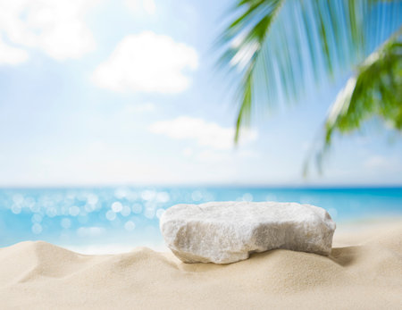 Summer sand and tropical sea background with abstract stone podiumの写真素材