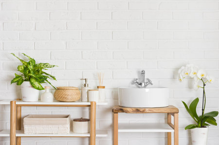 Round vessel sink and wooden shelf in stylish bathroom interiorの写真素材