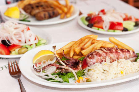 Sea food with salad in the restaurantの写真素材