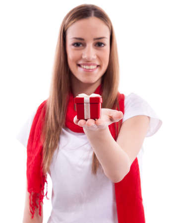 Smiling beautiful girl holding giftの写真素材