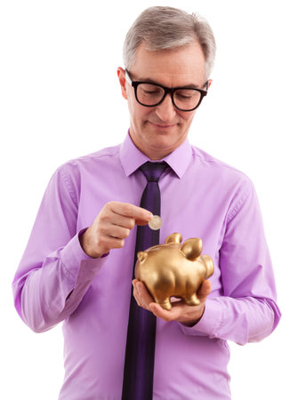 Businessman succes putting coin into piggy bankの写真素材