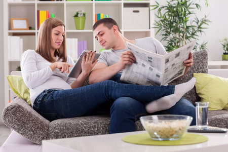 Happy enjoying family on sofaの写真素材