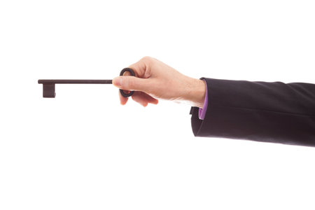 Businessman holding key close upの写真素材