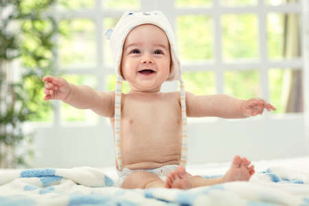 Smile and happiness baby joy on bedの写真素材