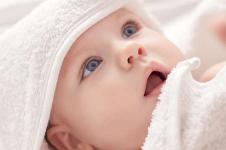 After bath baby with blue eyesの写真素材