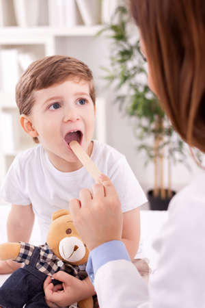 Adorable child and female doctor pediatricianの写真素材