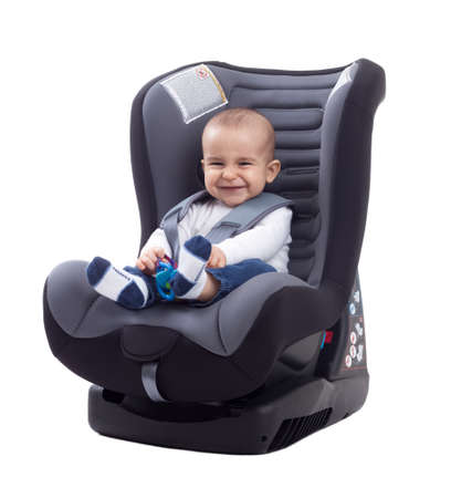 Smiling baby smiling and keep safe in car seat, siolatedの写真素材