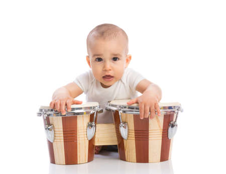 Funny smiling baby with bongos isolatedの写真素材