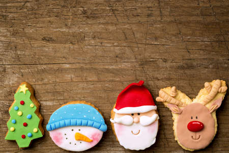Christmas biscuit cookies on old wooden backgroundの写真素材