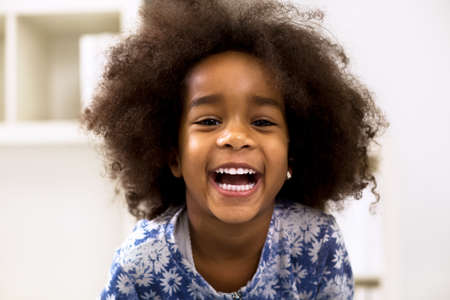 Smiling beautiful african girl with healthy white teethの写真素材
