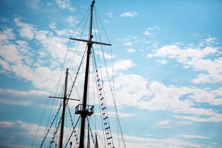 Sailboat sails and beautiful blue sky with clouds background