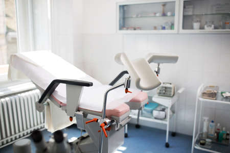 Gynecologist clinic examination, diagnostic equipment, beautiful white office.の写真素材