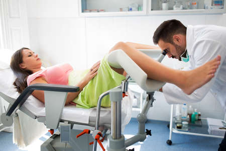 Gynecologist examining a patient with a colposcope, check up healthcare patient