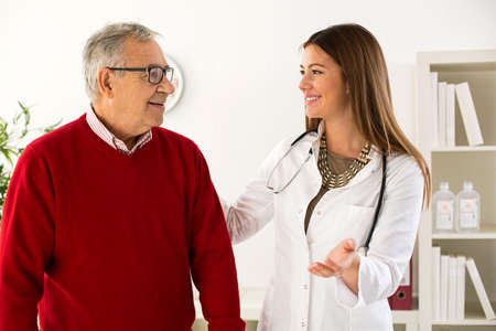Senior man on consultation with doctorの写真素材