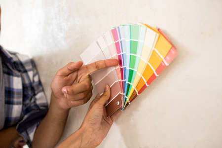 Couple choosing color for painting there new home, close upの写真素材