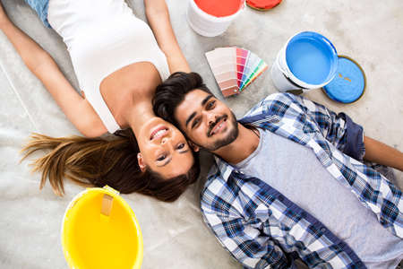 Happy young lovely couple renovation new homeの写真素材