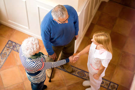 Nurse provide welcome to new patients at private clinic nursing homeの写真素材