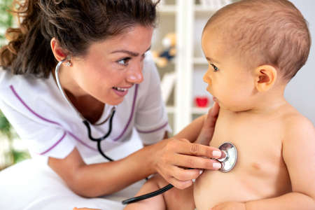 Listening of a babyï¿½s heart with stethoscope and providing healthcare