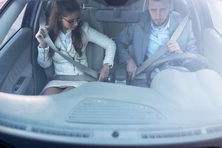 Clicking the seatbelt to its holding place is always a smart decision when you go for a rideの写真素材