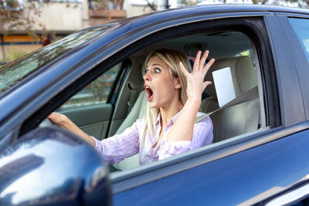 Upset driver caught in unpleasant situation, losing her temperの写真素材