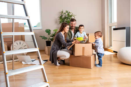 Loving family in their fresh new home just moving in