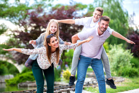 Happy family goofing around and having fun, family road