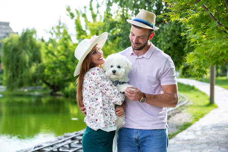 Lovely couple and their pet having a great time
