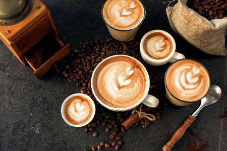 Espressos in espresso cups of all sizes with latte artの写真素材