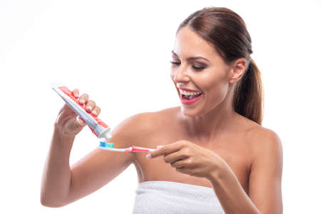 Woman with a beautiful smile preparing to brush her teeth, white teethの写真素材