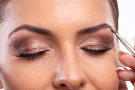 Filling the eyebrow with natural matching color makeup, making of a pretty appearance