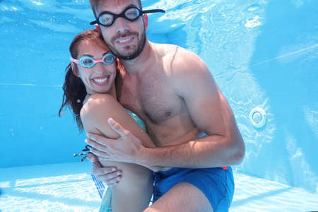Couple in an underwater hug, concept of underwater photography