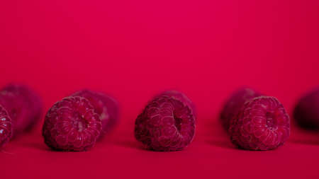 Three bottles for cosmetic products with white caps on a pink backgroundの写真素材