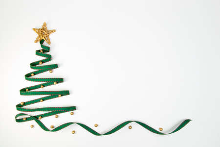 Christmas tree with green ribbon and golden star 2の写真素材