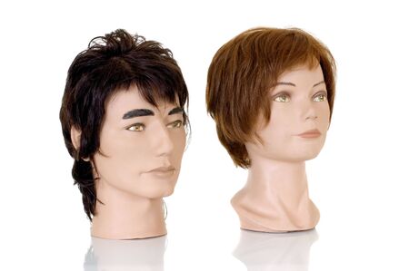 Modeling heads for hairdressers and makeup artist on white background, reflective surface, studio shot, の写真素材