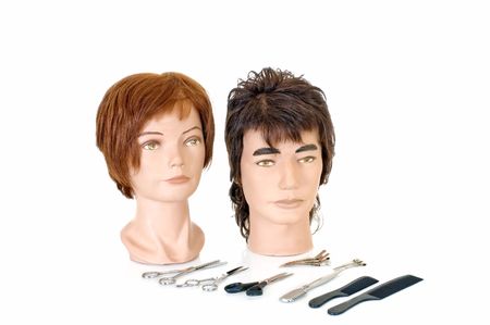 Modeling heads for hairdressers and makeup artist on white background, reflective surface, studio shot, の写真素材