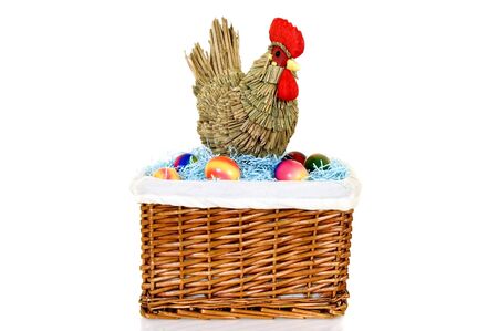 Chicken with boiled colorful painted Easter eggs on white backgroundの写真素材