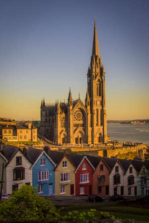 Beautiful colors in the sunset and St Colman Cathedral of Cobh in Ireland.の写真素材