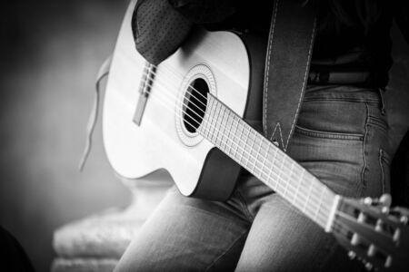 Detail of a singer girl playing the guitarの写真素材