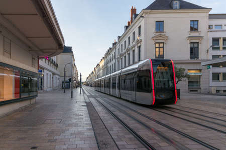Tours, France - 07 25 2019: Electric tram rolling in a pedestrian street in the historic city center on a summer sunsetのeditorial素材