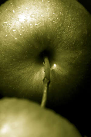 green apples against a black backgroundの写真素材