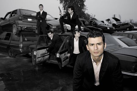 Gangster in action. Multiple shots of the same guy getting out of a demolished carの写真素材