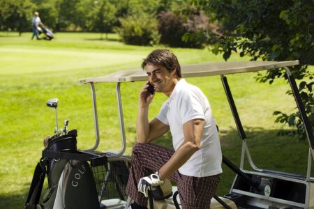 Golf club: golfer concentrating on the 18th hole  の写真素材