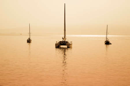 sailing boat anchored in a port in Sardinia の写真素材